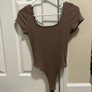 Brown body suit